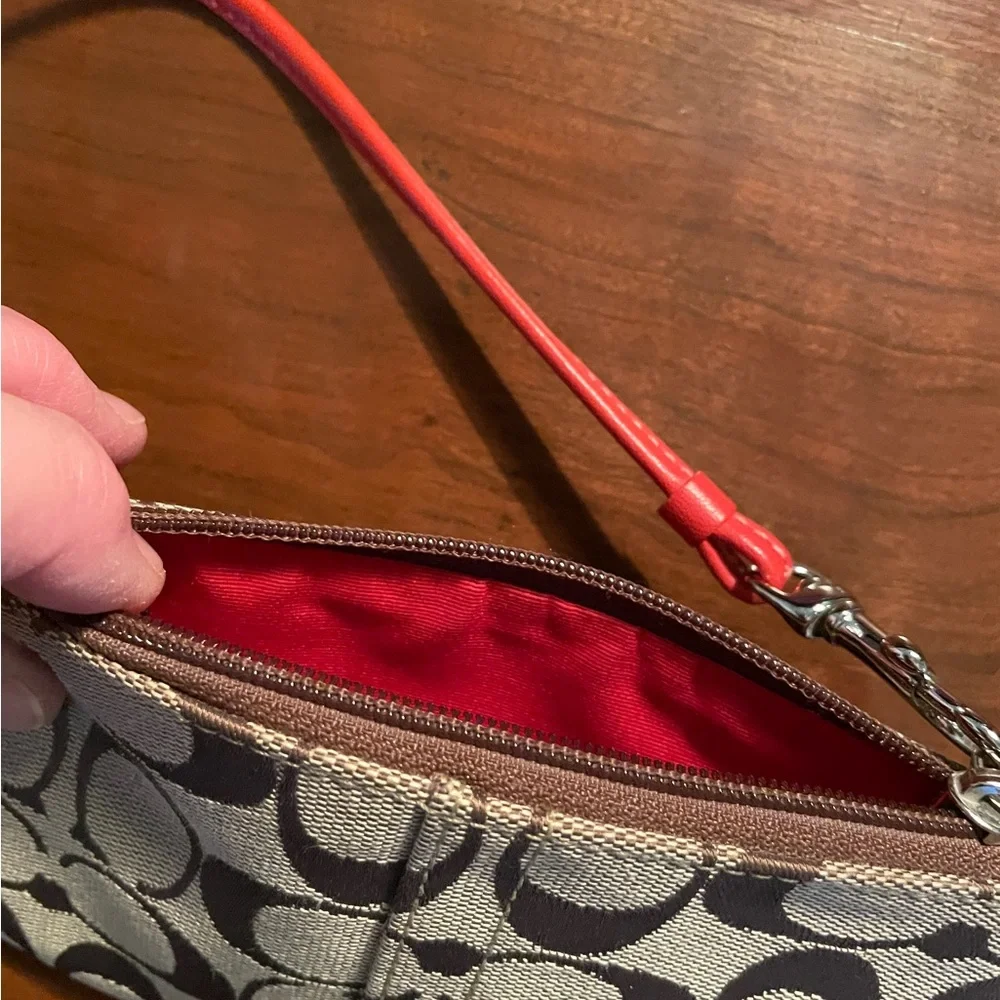 COACH Signature Fabric with Orange Leather Wristlet